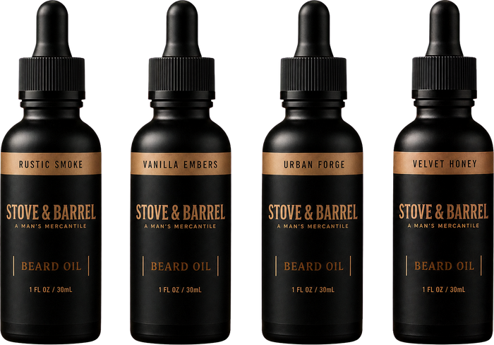 Four Stove & Barrel beard oil bottles in Rustic Smoke, Vanilla Embers, Urban Forge, Velvet Honey scents