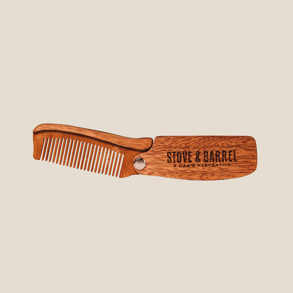 Wooden folding beard comb by Stove & Barrel for men's grooming and styling